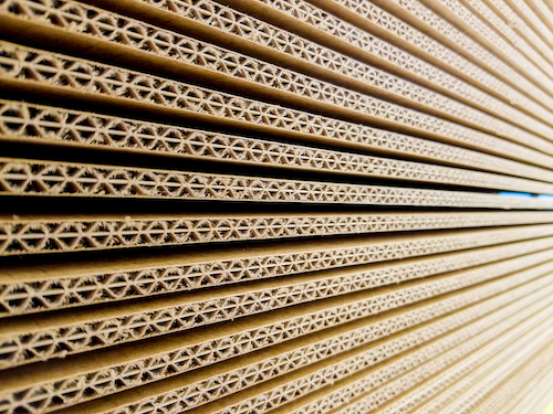 Macro texture of cardboard. Abstract texture and background for designers. Brown paper texture and pattern